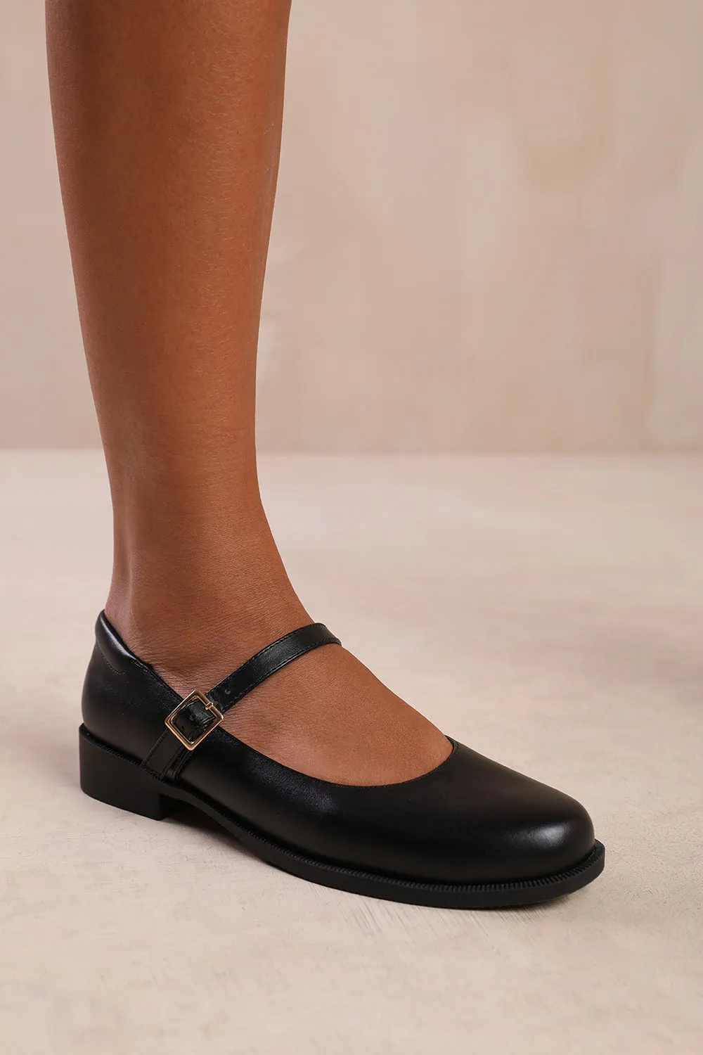 KINGSTON WIDE FIT LOW HEEL LOAFER WITH STRAP AND BUCKLE DETAIL IN BLACK FAUX LEATHER