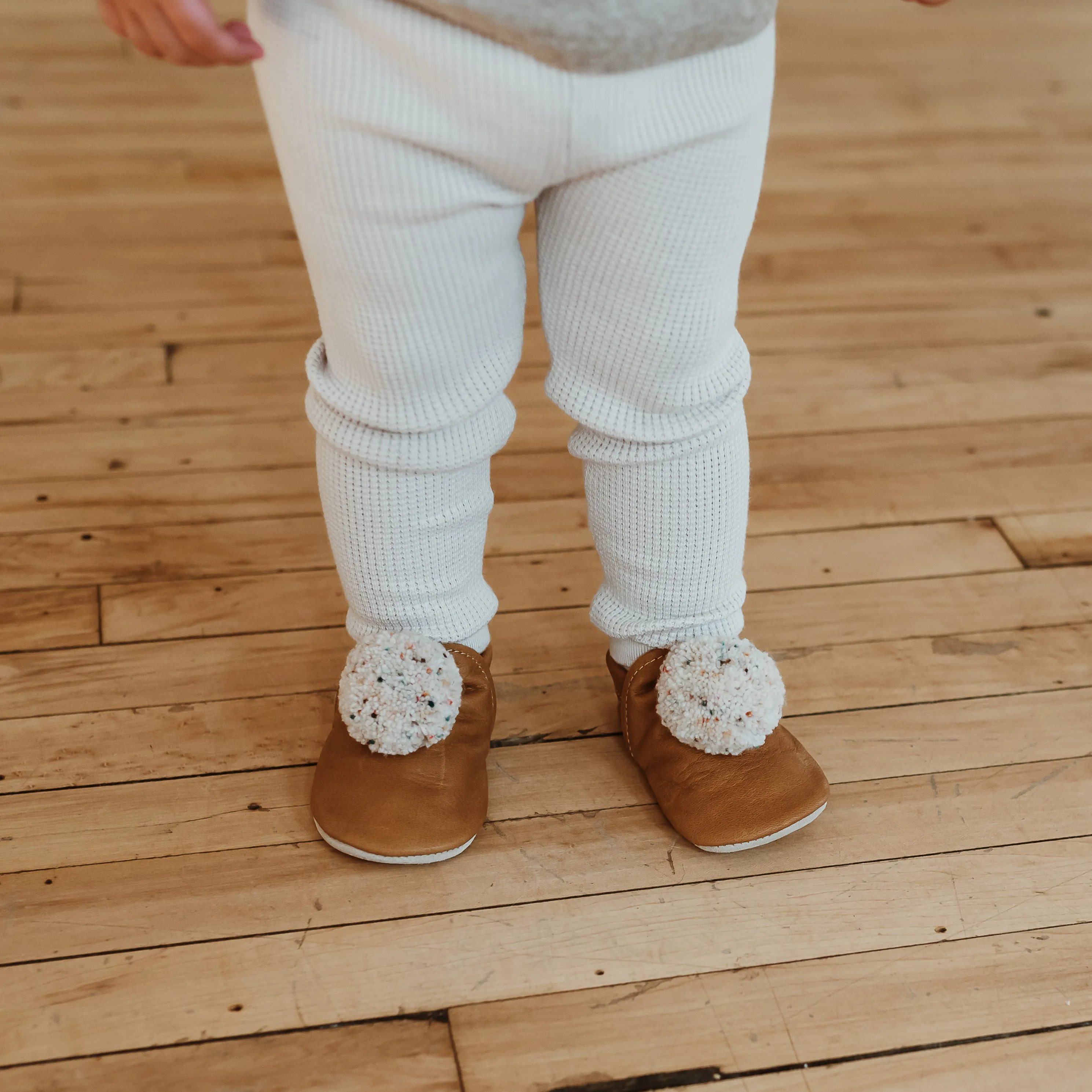 leather pompom shoes